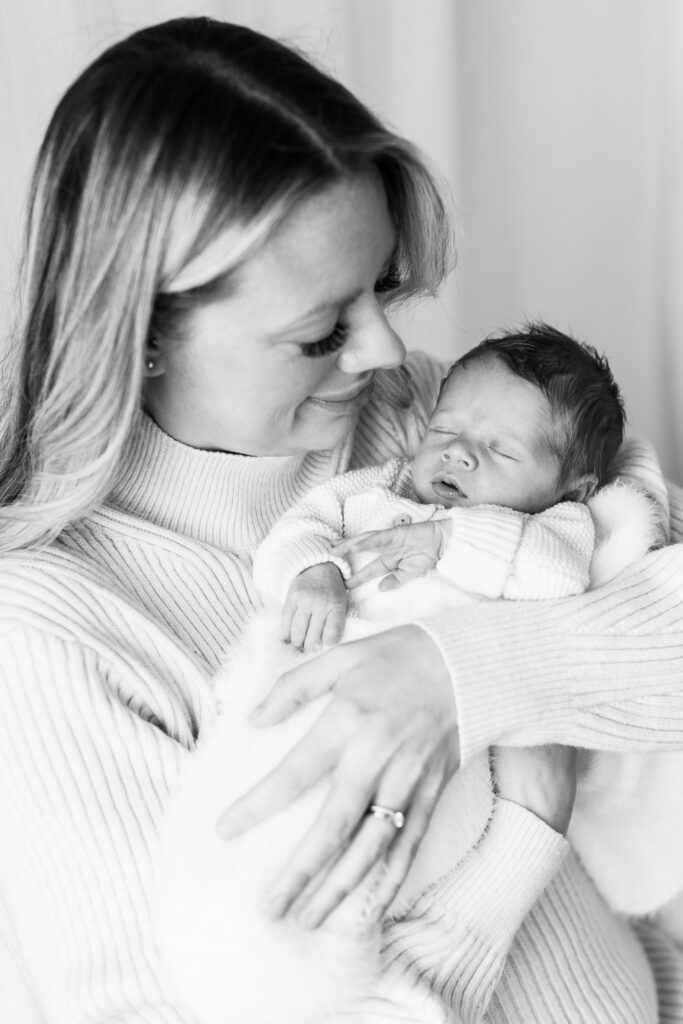 Black and white photo of mum and her newborn